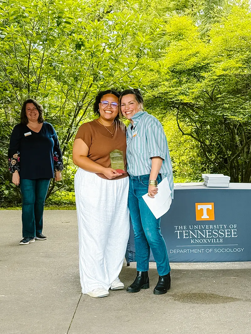 Madison Howard stands with Associate Professor and Executive Associate Head Michelle Christian as she receives an award.